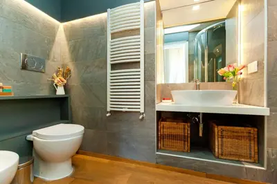 a bathroom with a toilet and a sink at River House in Rome