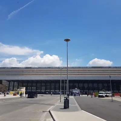a large building with a street light in a parking lot at Chez Pierre tourist rental in Rome