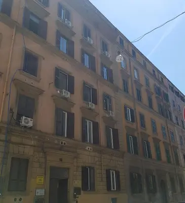a large building with windows on the side of it at Chez Pierre tourist rental in Rome
