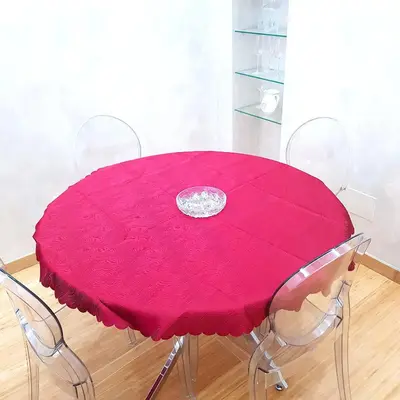a dining room table with a pink tablecloth and chairs at Chez Pierre tourist rental in Rome