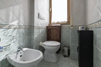 a bathroom with a toilet and a sink at Pigneto Apartment in Rome