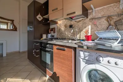 a kitchen with a washer and a washing machine at Pigneto Apartment in Rome