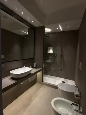 a bathroom with a tub and a sink and a shower at Spiriti Home Apartment , New Opening Piazza di Pietra in Rome