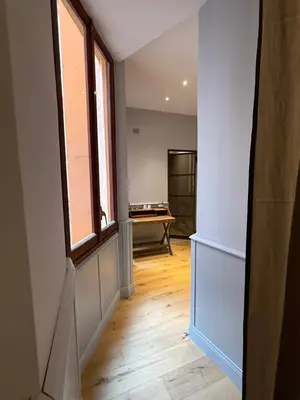 a hallway with a room with a desk and a window at Spiriti Home Apartment 3, New Opening Piazza di Pietra in Rome