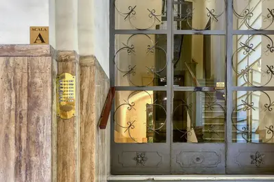 a door to a store with a lot ofitures in it at Lavinia's Apartment at Colosseo in Rome
