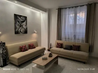 a living room with two couches and a coffee table at Maison Vittoria in Rome
