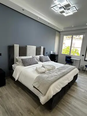 a bedroom with a large bed in a room at B&B GarbaCity-Inn in Rome