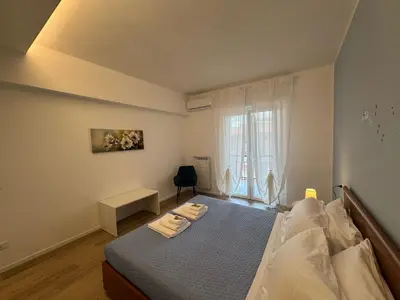 a bedroom with a bed and a window at Sunny Stay with a Roman Soul in Rome