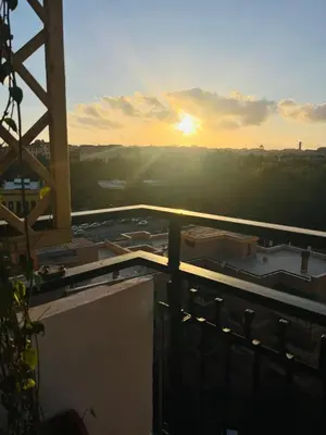 a view of the sunset from the top of a building at Sunny Stay with a Roman Soul in Rome