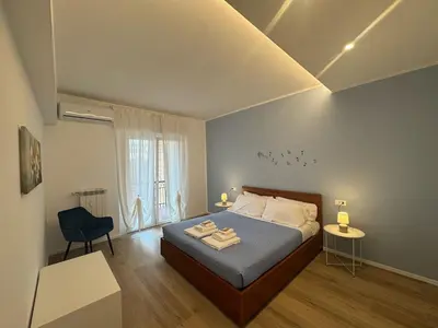 a bedroom with a bed with two towels on it at Sunny Stay with a Roman Soul in Rome
