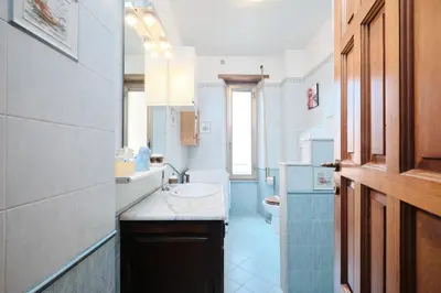 a bathroom with a sink and a toilet at Metro A 10 minutes - Free Wi-Fi & Netflix in Rome