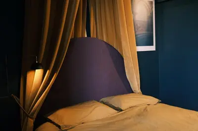 a bed in a room with a curtain at Testaccio Room in Rome in Rome