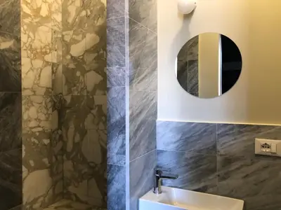 a bathroom with a sink and a mirror at Testaccio Room in Rome in Rome