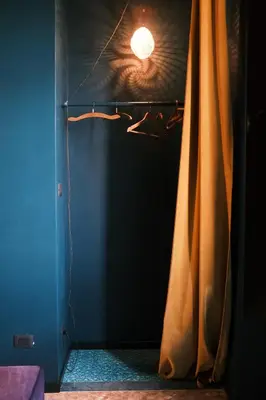 a room with curtains and a light on the wall at Testaccio Room in Rome in Rome