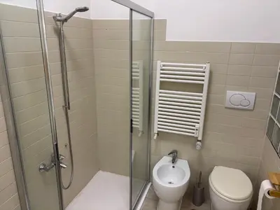 a bathroom with a shower and a toilet at da Nonna Dina in Rome