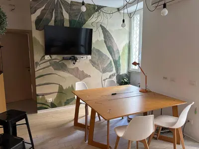 a dining room with a wooden table and chairs at da Nonna Dina in Rome