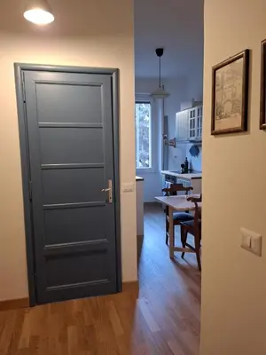 a door leading into a kitchen with a table at Appartamento viale Mazzini in Rome