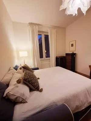 a bedroom with a bed with a teddy bear on it at Appartamento viale Mazzini in Rome