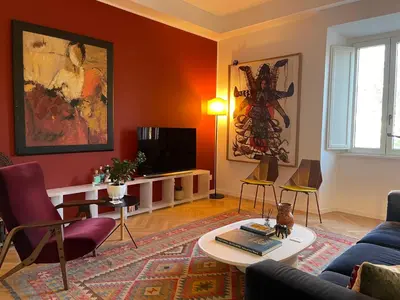 a living room with a couch and a table at Terme di Tito Colosseum in Rome