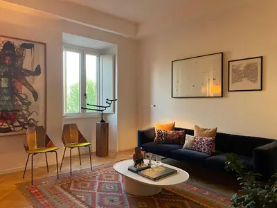 a living room with a couch and a table at Terme di Tito Colosseum in Rome