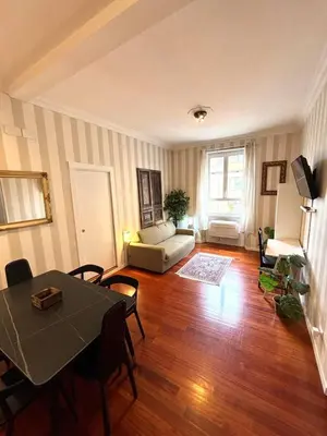 a living room with a table and a couch at Vatican Home - San Pietro - Near to Metro A in Rome