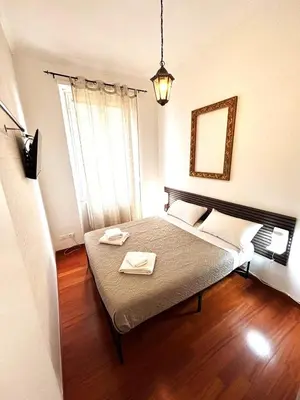 a bedroom with a bed with two towels on it at Vatican Home - San Pietro - Near to Metro A in Rome
