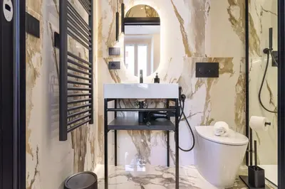 a bathroom with a sink and a toilet at Minerva Boutique Suites in Rome