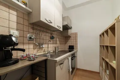 a small kitchen with a sink and a counter at GuestHost - Roma Termini Lovely Flat in Rome