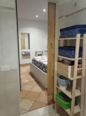 a bedroom with a bunk bed and a mirror at My Cocoon in Rome