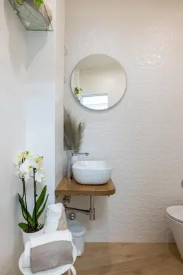 a bathroom with a sink and a mirror at NOSTROMONDO-Elegant Suite with patio in Monti Parioli in Rome