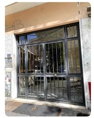 a door to a building with black iron gates at Bart Rome House in Rome