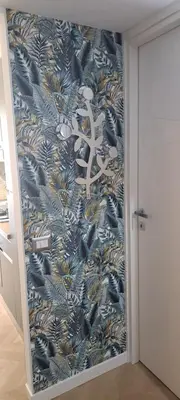 a hallway with a blue and gold wallpaper at Bart Rome House in Rome