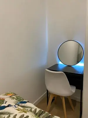 a desk with a mirror and a chair next to a bed at Bart Rome House in Rome