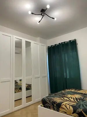 a bedroom with a bed and a ceiling fan at Bart Rome House in Rome