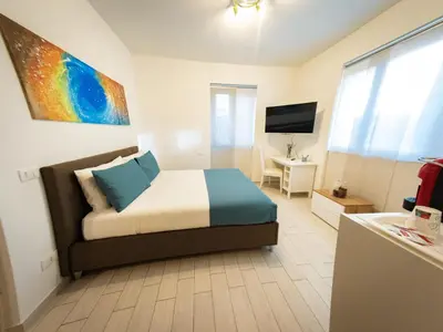 a bedroom with a bed and a television in it at La Stella di Roma al Vaticano in Rome