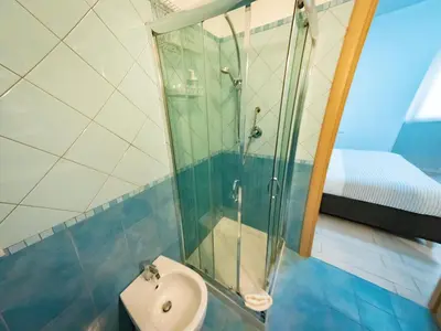 a bathroom with a sink and a shower at La Stella di Roma al Vaticano in Rome