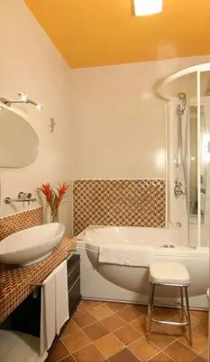 a bathroom with a white tub and a sink at Respighi Apartments - Rome City Center in Rome