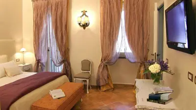 a bedroom with a bed and a window with curtains at Respighi Apartments - Rome City Center in Rome