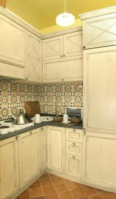 a white kitchen with white cabinets and a sink at Respighi Apartments - Rome City Center in Rome