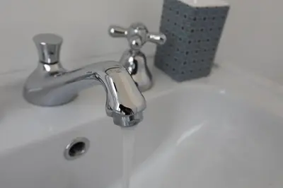 a bathroom sink with a silver bathroom faucet at Colosseum Panoramic Terrace in Rome