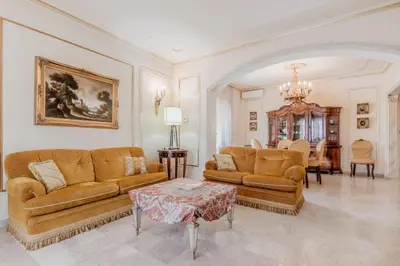 a living room with two couches and a table at Casa da Annarella in Rome