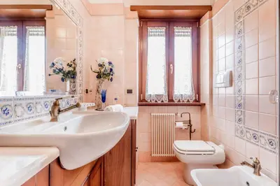 a bathroom with a sink and a toilet at Casa da Annarella in Rome