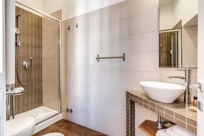 a bathroom with a sink and a shower at Little Queen Relais in Rome