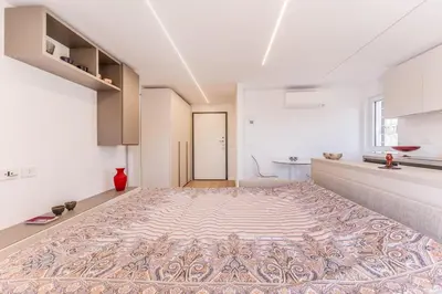 a living room with a large rug on the floor at APT ROME Sergio I - San Pietro Vatican in Rome