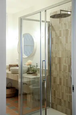 a bathroom with a glass shower with a sink at Flowers Rooms - Ponte Milvio in Rome