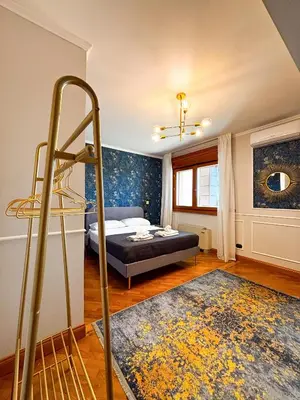 a bedroom with a bed and a ladder in it at Luxury House Alessia in Rome