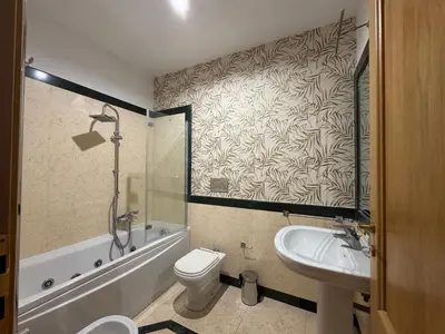 a bathroom with a toilet and a sink and a shower at Luxury House Alessia in Rome