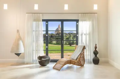 a room with a window with a view of a building at Dimora della Luna in Rome