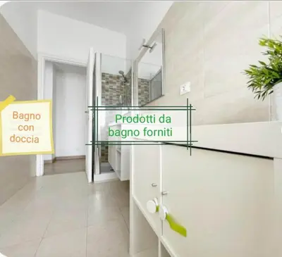 a bathroom with a mirror and a sink in a room at Vacanze romane in Rome