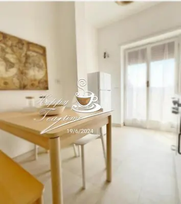 a table with a cup of coffee on top of it at Vacanze romane in Rome